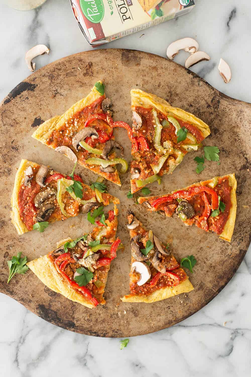 Polenta Pizza! Healthy, gluten-free take on pizza. Creamy polenta crust topped with sauce, veggies and vegan parmesan cheese. A must-make. | www.delishknowledge.com