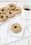 Pumpkin Donuts with Maple-Pecan Frosting! A healthy take on donuts! Save this one for company this fall!