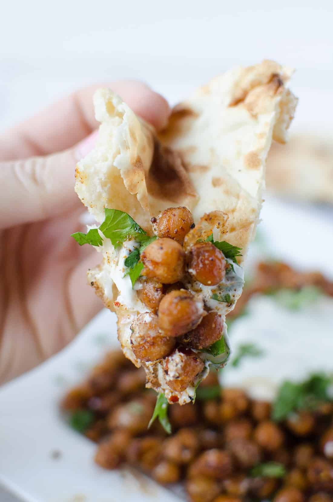 Dinner is ready in just 15 minutes! Roasted Indian chickpeas with tamarind sauce, yogurt and cilantro. Healthy, high protein and easy! | www.delishknowledge.com