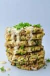 Greek Quinoa Zucchini Fritters! Crispy zucchini fritters with a garlic-hummus sauce. Perfect for leftover zucchini! | www.delishknowledge.com