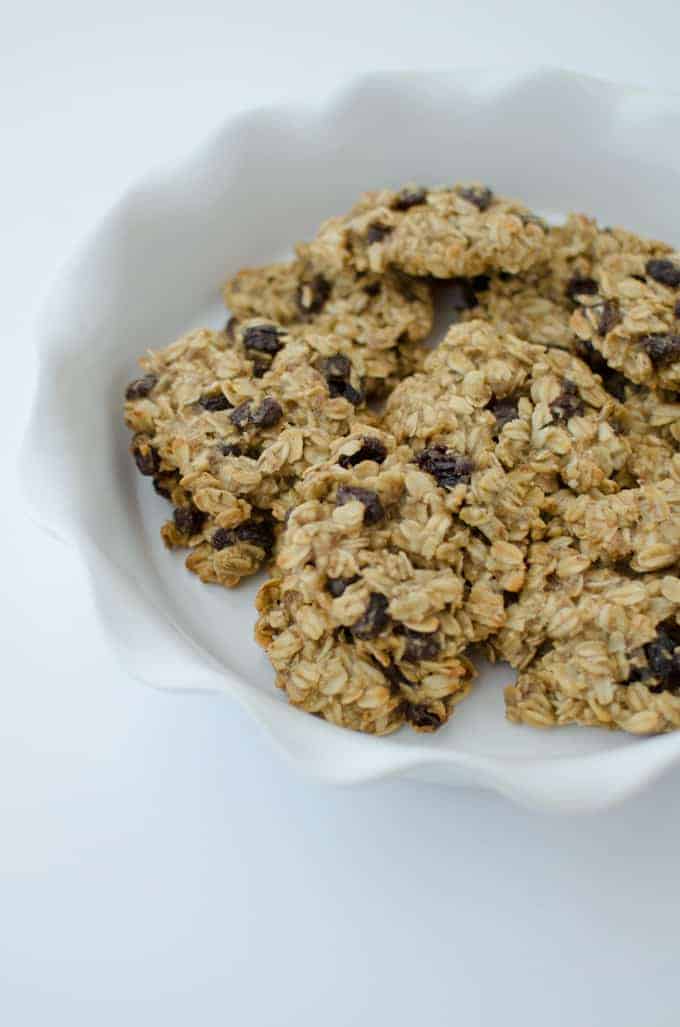 Healthy oatmeal raisin cookies! Lightly sweetened with a touch of maple syrup and raisins! Chunky oatmeal cookies that are vegan with gluten-free option! Recipe on delishknowledge.com
