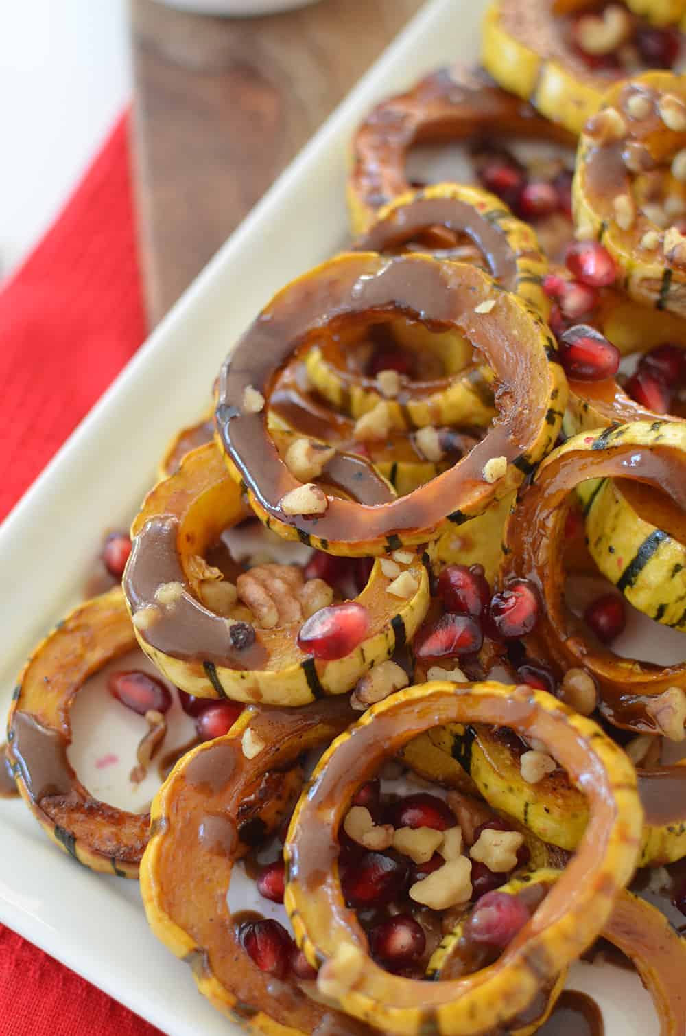 Pomegranate Roasted Delicata Squash! Caramelized Squash With A Pomegranate-Maple Dressing And Fresh Pomegranate Seeds! A Vegan And Gluten-Free Side Dish, Perfect For Thanksgiving Or The Holidays! | Www.delishknowledge.com