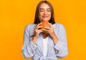 woman about to eat burger