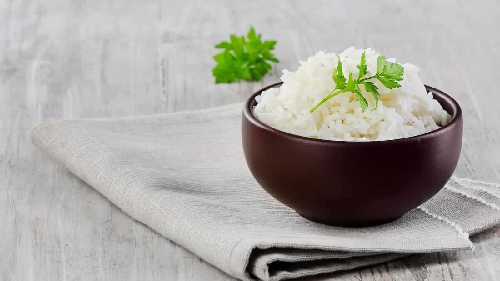16 Foods with Expiration Dates You Can Ignore 2 White Rice On A Wooden Table. Selective Focus