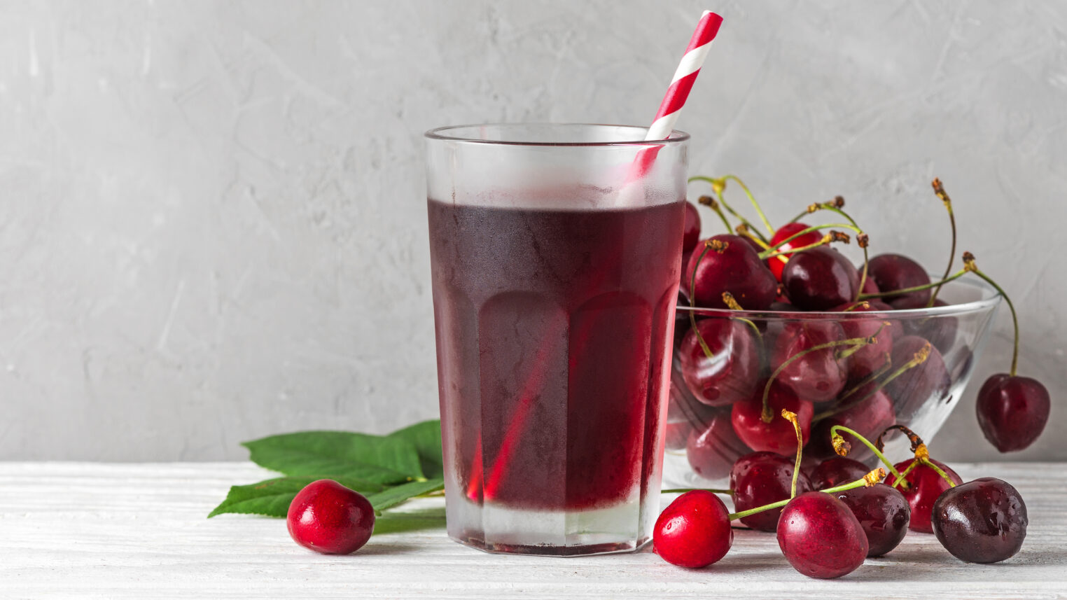 Glass,Of,Cold,Cherry,Juice,With,A,Straw,And,Fresh