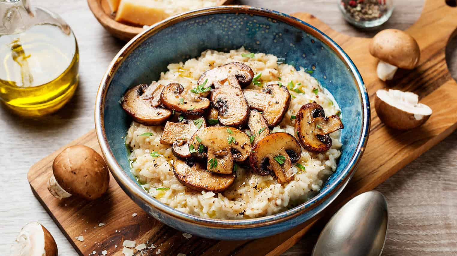 Risotto,With,Brown,Champignon,Mushrooms,On,Wooden,Background.