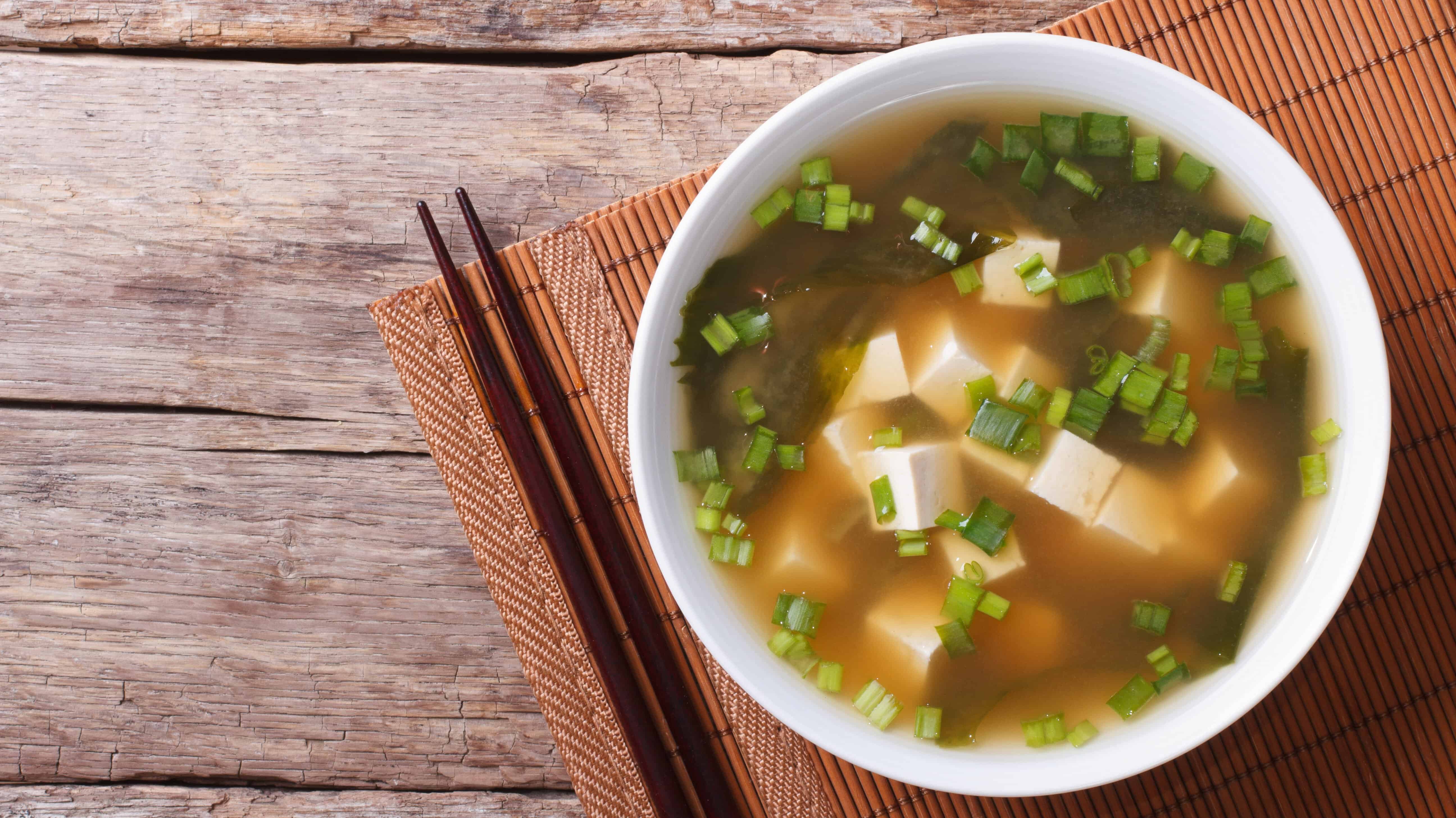 Japanese,Miso,Soup,In,A,White,Bowl,On,The,Table.