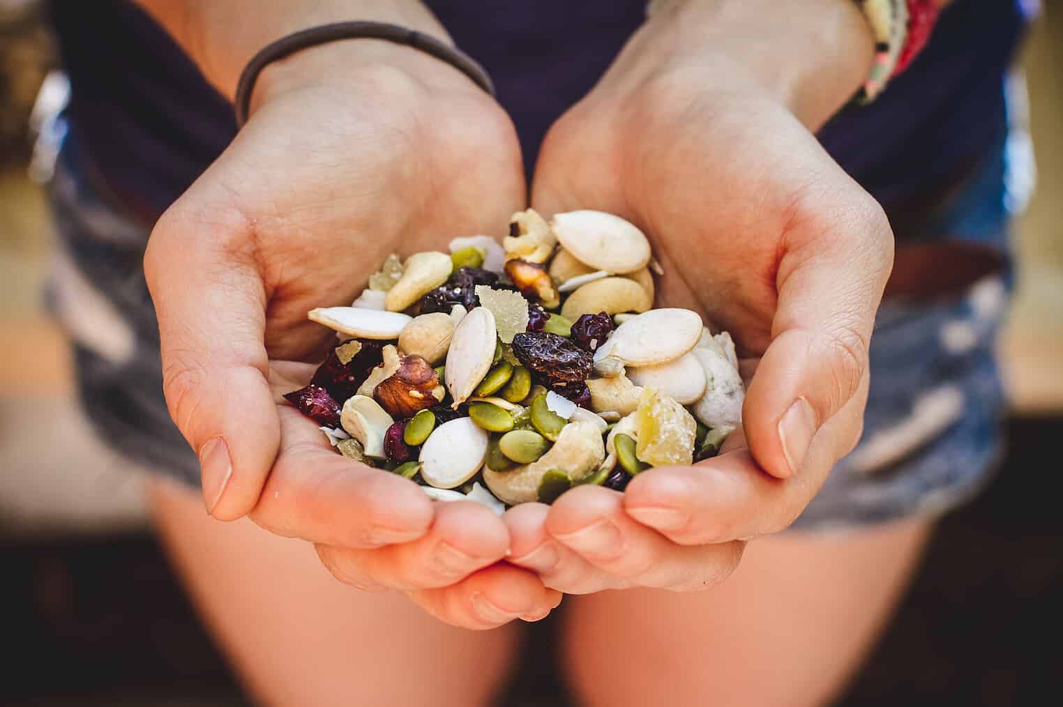 22 Packaged Snacks You Can Actually Feel Good About Eating 18 Hands Cupping Homemade Trail Mix