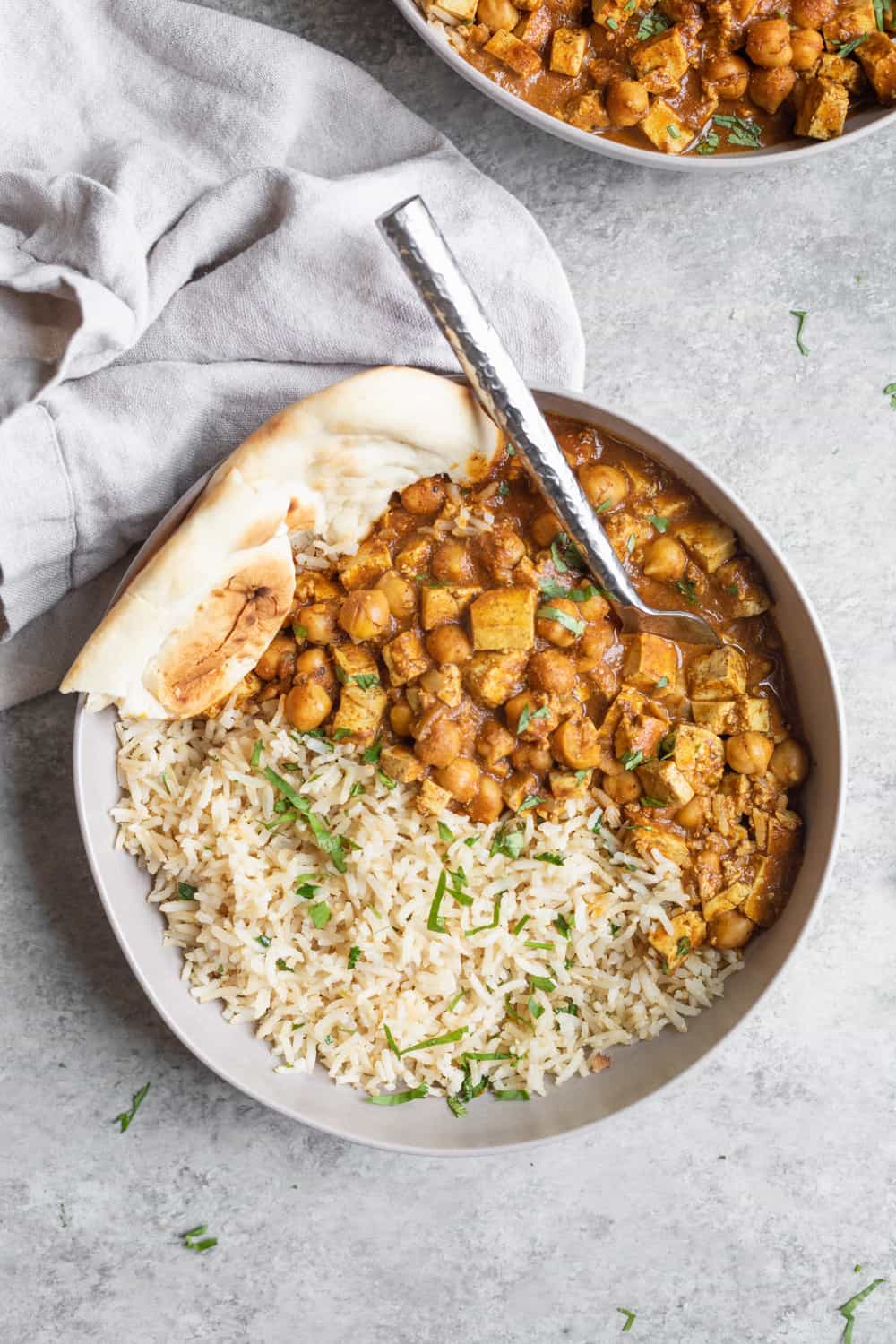 Slow Cooker Butter Chickpeas In A Bowl With Naan