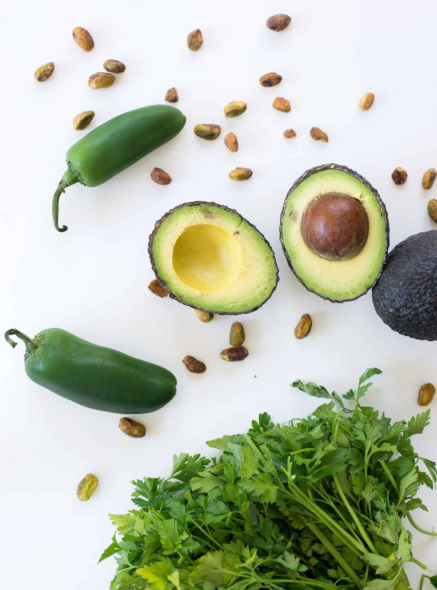 Spicy Green Sauce! Pesto meets guacamole! You are going to love this healthy sauce, perfect for topping on just about everything. Tacos, sandwiches, pasta, ect. Vegan & Gluten-free | www.delishknowledge.com
