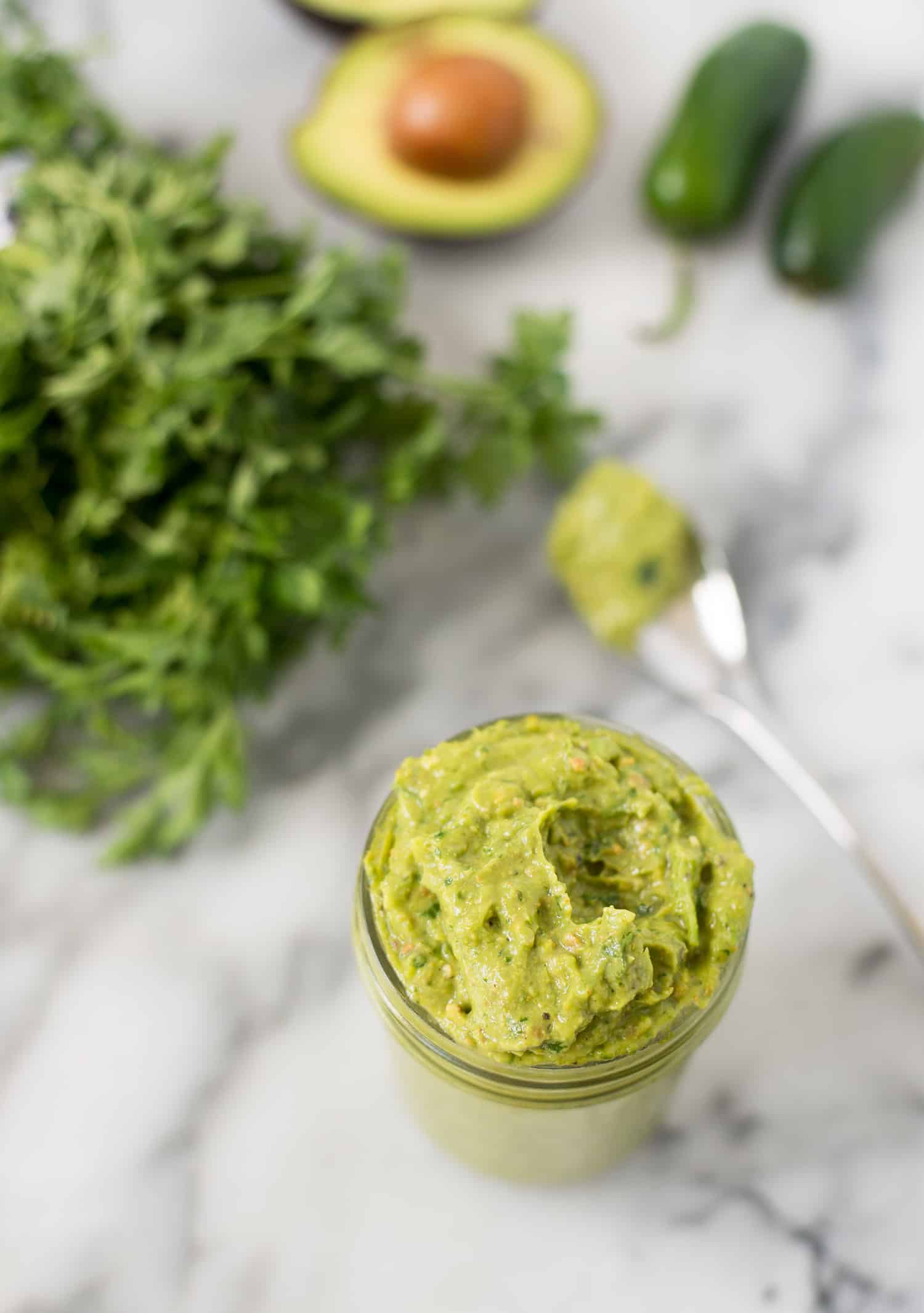 Spicy Green Sauce! Pesto meets guacamole! You are going to love this healthy sauce, perfect for topping on just about everything. Tacos, sandwiches, pasta, ect. Vegan & Gluten-free | www.delishknowledge.com