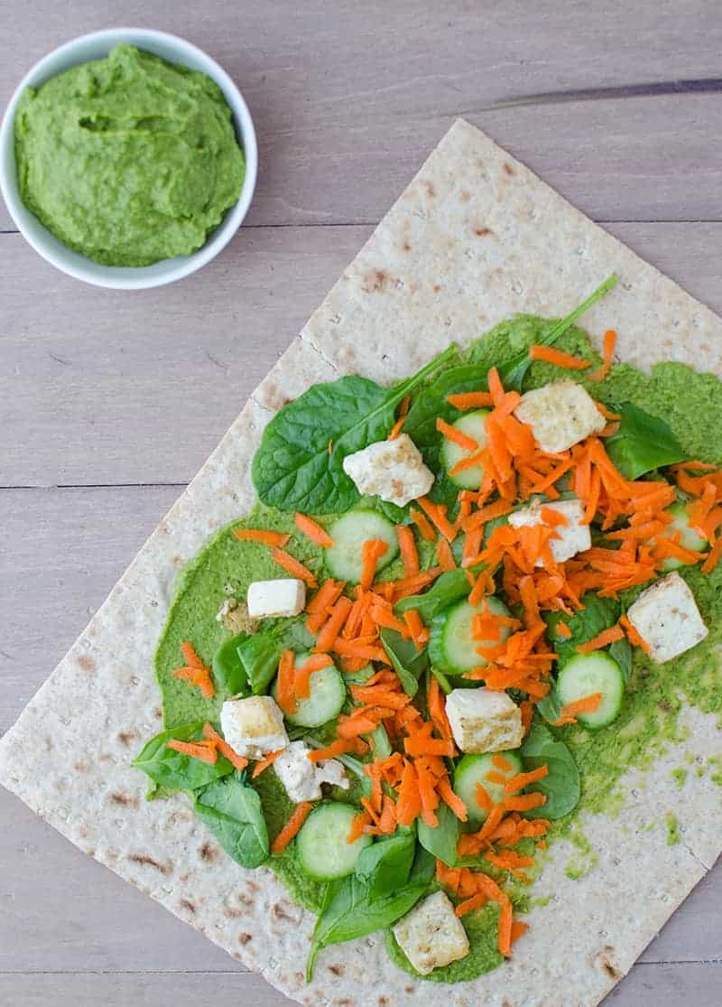 Spinach Hummus! Slightly Spicy Hummus Wrapped Into Whole Wheat Lavish Bread And Topped With Veggies And Lightly Fried Tofu. Healthy And Filling Lunch!