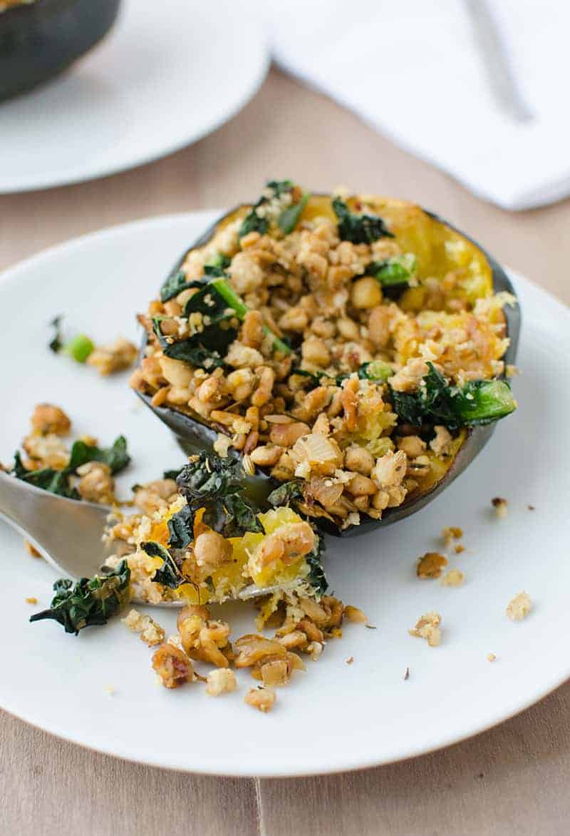 Stuffed Squash! The Perfect Centerpiece For Thanksgiving Or Christmas. Vegan And Gluten-Free. Acorn Squash Stuffed With Homemade Temeph Sausage, Kale, And Topped With A Walnut Crumble. | Www.delishknowledge.com