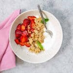 strawberry yogurt bowl with coconut granola