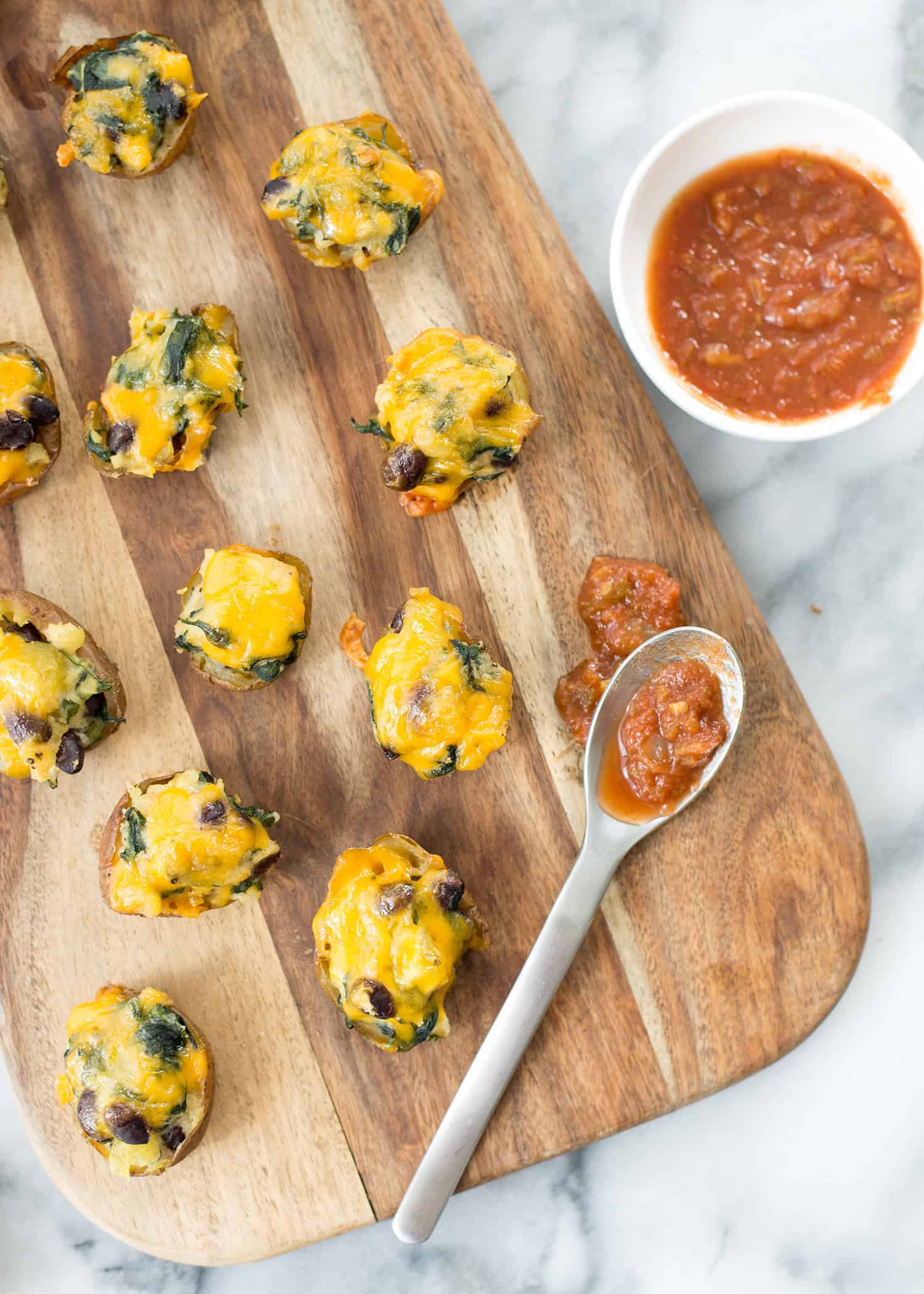 Vegetarian Southwestern Stuffed Potato Skins! Spicy Potato, Beans And Spinach Stuffed Into Potato Skins And Covered With Mexican Cheese. Vegetarian And Gluten-Free | Www.delishknowledge.com