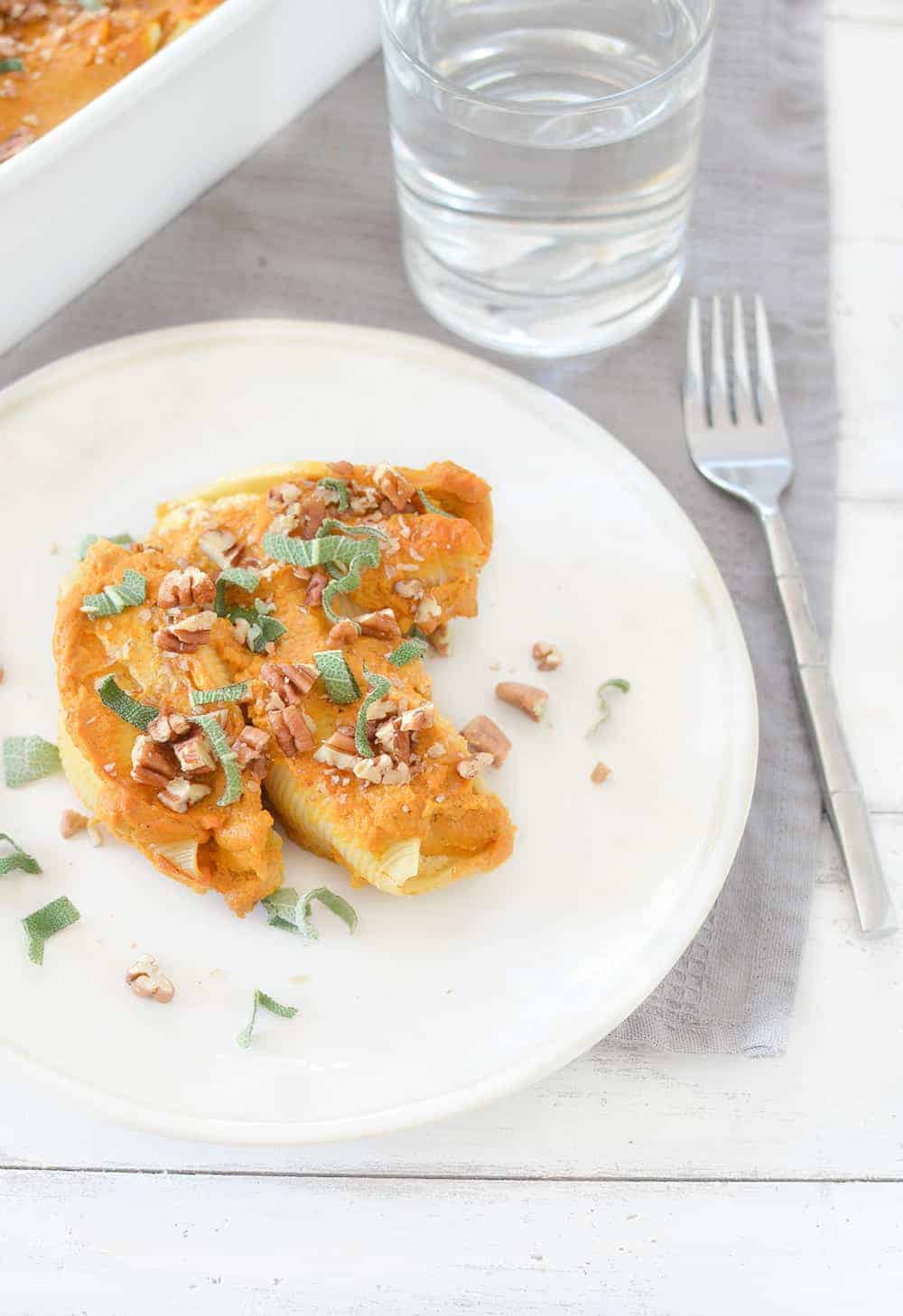Vegan Stuffed Shells with Pumpkin Cream Sauce! Tofu ricotta stuffed into jumbo shells and baked in a creamy pumpkin sauce. Showstopper dinner for the holidays! | www.delishknowledge.com