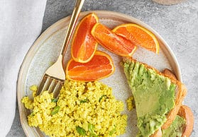 eggy tofu scramble with avocado toast and oranges