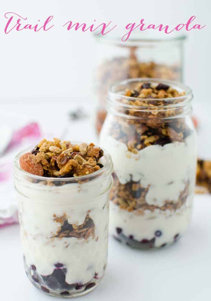 Trail mix granola! Healthy baked granola clusters of almonds, sunflower seeds, and walnuts. Layered in jars with frozen fruit and yogurt for a quick on-the-go breakfast! Vegan or vegetarian; gluten-free