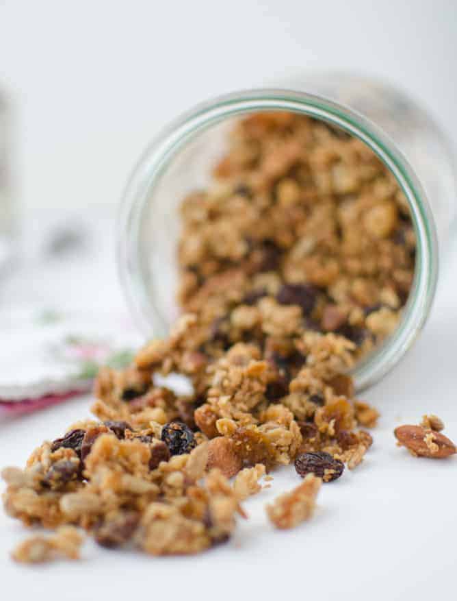 Trail mix granola! Healthy baked granola clusters of almonds, sunflower seeds, and walnuts. Layered in jars with frozen fruit and yogurt for a quick on-the-go breakfast! Vegan or vegetarian; gluten-free