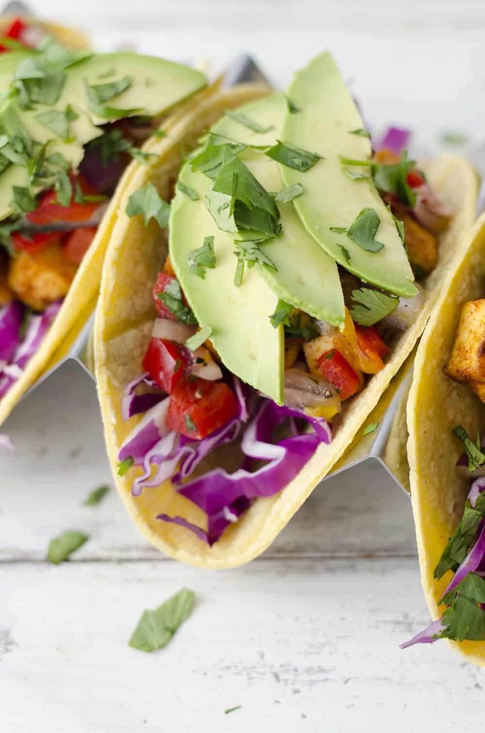 Tropical Tofu Tacos with Mango Salsa! Jerk seasoned tofu with quick mango salsa, shredded cabbage and sliced avocado. | www.delishknowledge.com