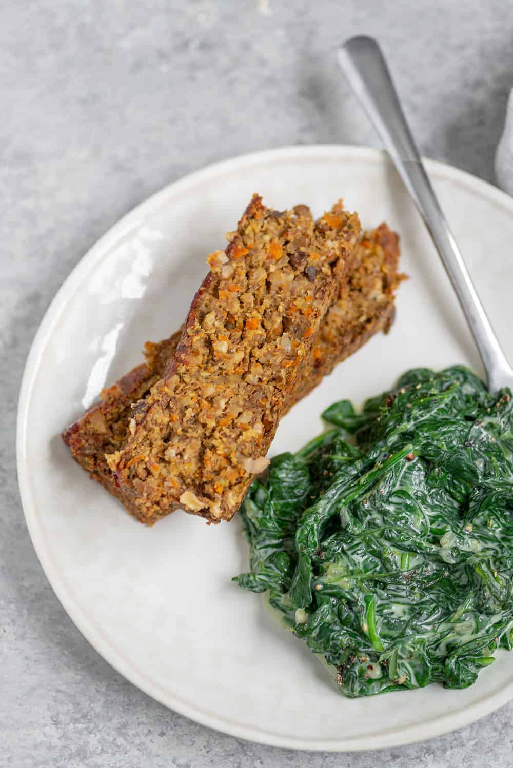 35 Easy Vegan Lentil Recipes 13 Lentil Loaf On White Plate With Spinach