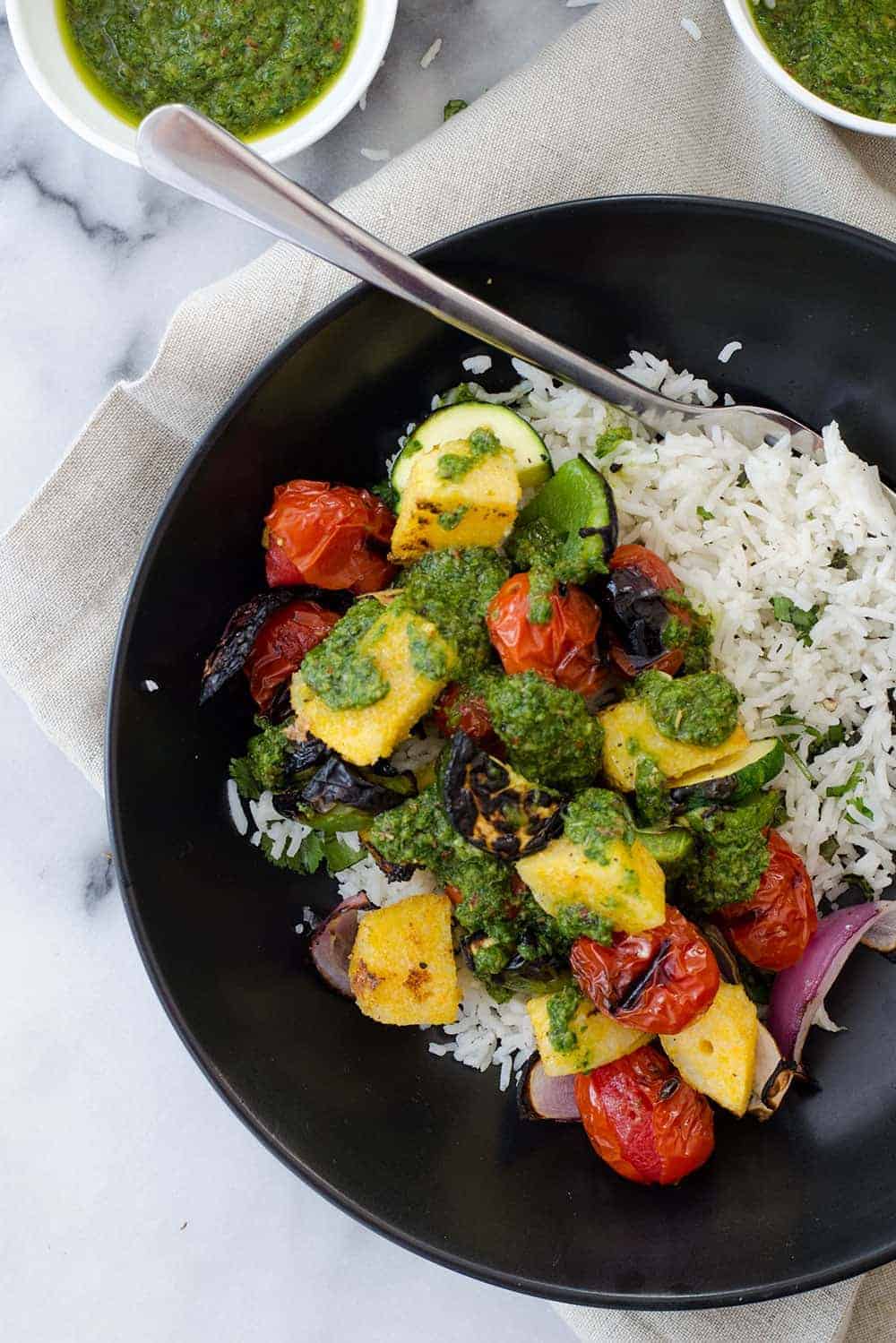 Vegan Polenta Kebobs With Chimichurri Sauce! Perfect For Cookouts This Summer! Served With Herbed Rice, This Vegan And Glutenfree Dish Is A Must Make. | Delishknowledge.com