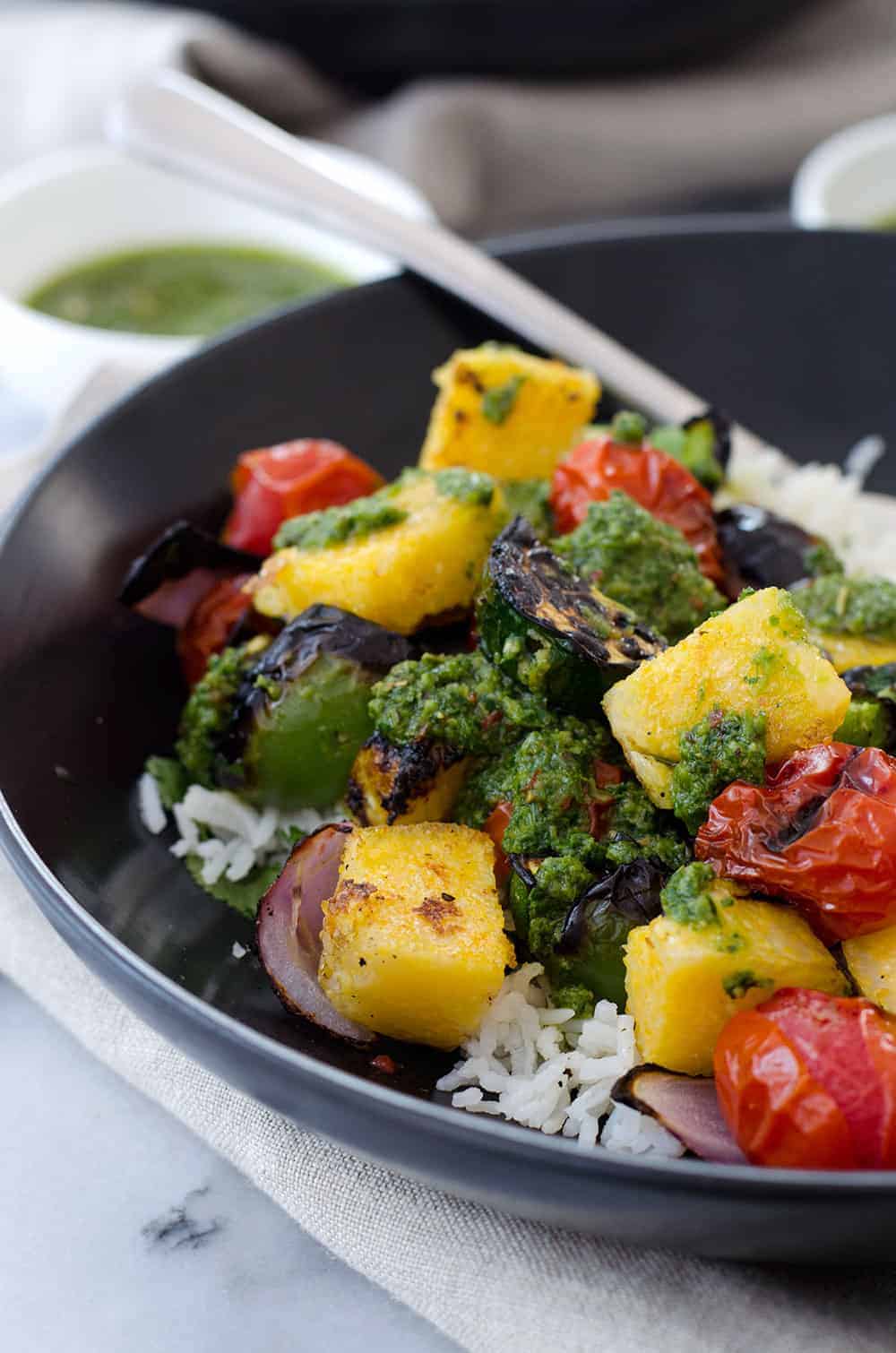 Vegan Polenta Kebobs With Chimichurri Sauce! Perfect For Cookouts This Summer! Served With Herbed Rice, This Vegan And Glutenfree Dish Is A Must Make. | Delishknowledge.com