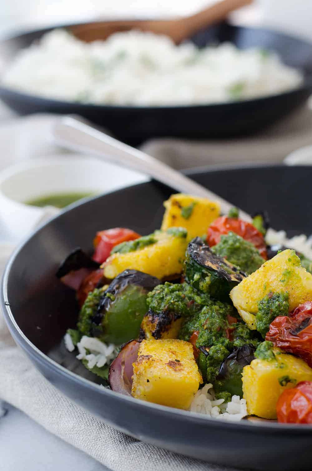 Vegan Polenta Kebobs With Chimichurri Sauce! Perfect For Cookouts This Summer! Served With Herbed Rice, This Vegan And Glutenfree Dish Is A Must Make. | Delishknowledge.com