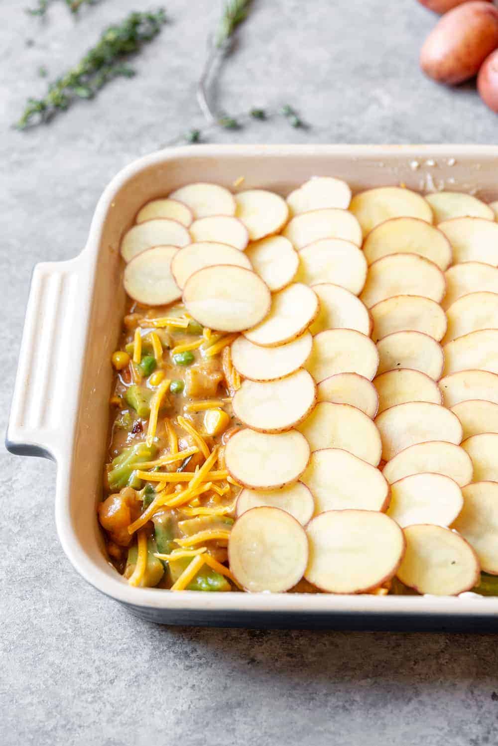 vegetable pot pie with scalloped potato crust 