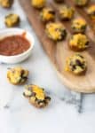 Vegetarian Southwestern Stuffed Potato Skins! Spicy potato, beans and spinach stuffed into potato skins and covered with mexican cheese. Vegetarian and Gluten-Free | www.delishknowledge.com