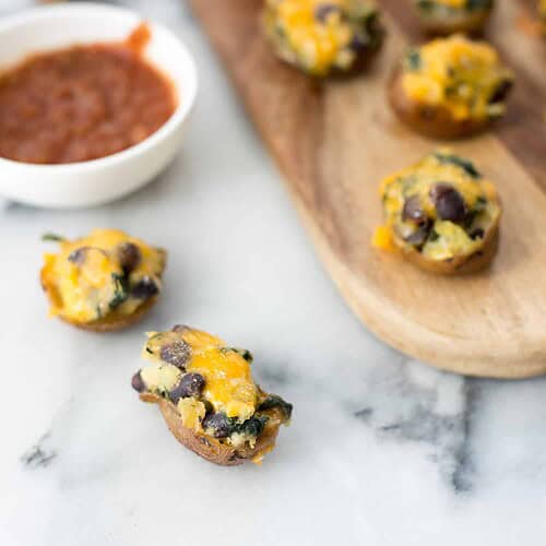 Vegetarian Southwestern Stuffed Potato Skins! Spicy Potato, Beans And Spinach Stuffed Into Potato Skins And Covered With Mexican Cheese. Vegetarian And Gluten-Free | Www.delishknowledge.com