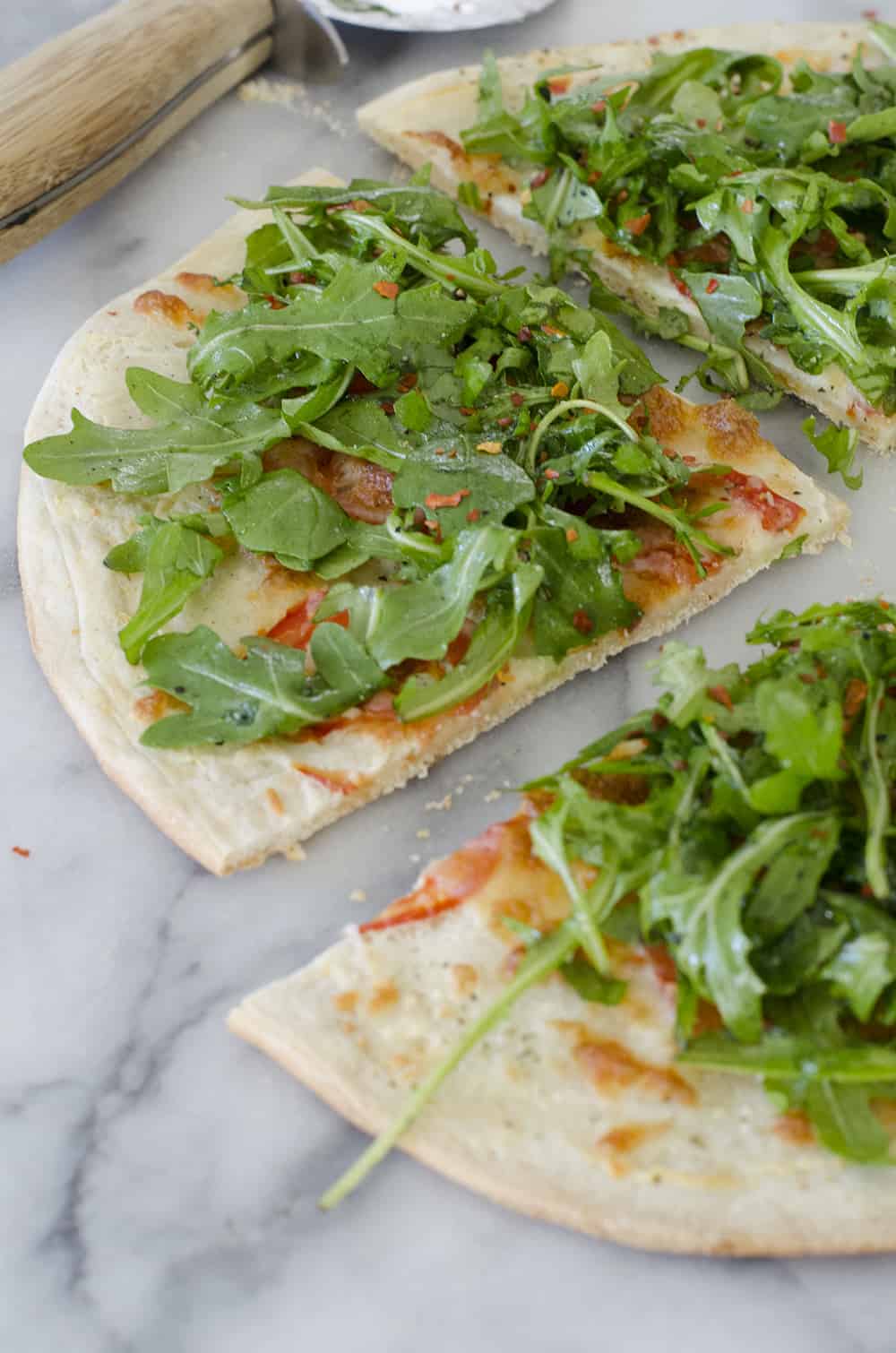 White Pizza with Arugula for Two! This pizza is ready in just 30 minutes and serves 2. White Pizza with spicy arugula salad. | www.delishknowledge.com