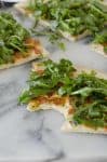 White Pizza with Arugula for Two! This pizza is ready in just 30 minutes and serves 2. White Pizza with spicy arugula salad. | www.delishknowledge.com