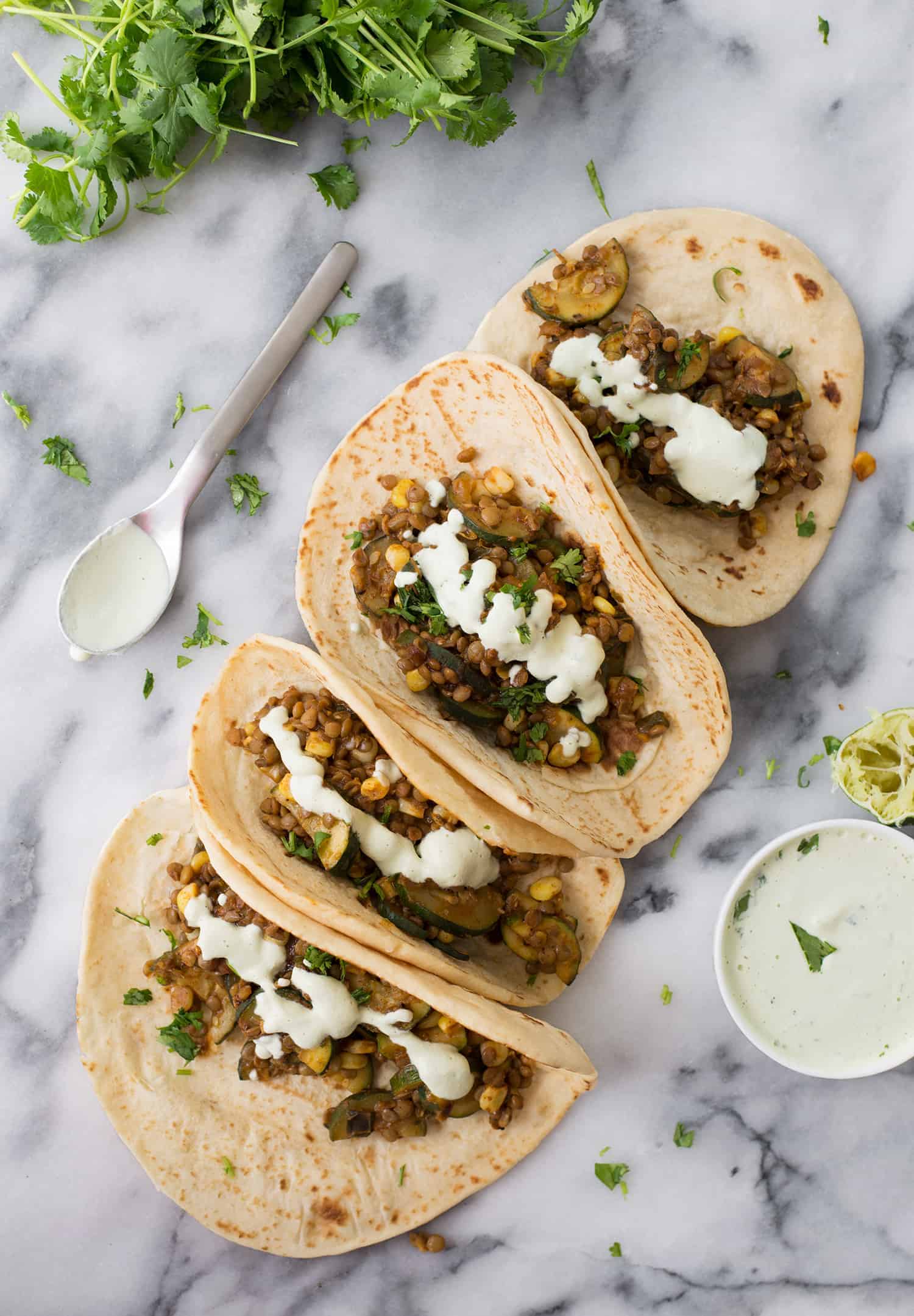 Zucchini And Lentil Tacos! A Perfect Vegan Dinner. Spicy Zucchini And Corn, Lentils With A Creamy Jalapeno-Lime Sauce. | Www.delishknowledge.com