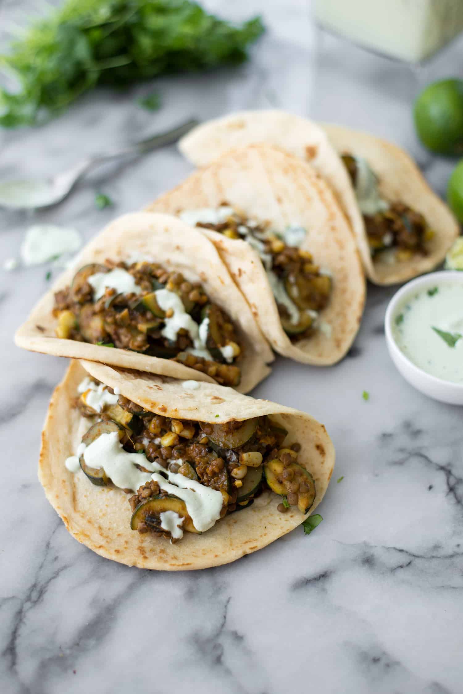 Zucchini And Lentil Tacos! A Perfect Vegan Dinner. Spicy Zucchini And Corn, Lentils With A Creamy Jalapeno-Lime Sauce. | Www.delishknowledge.com