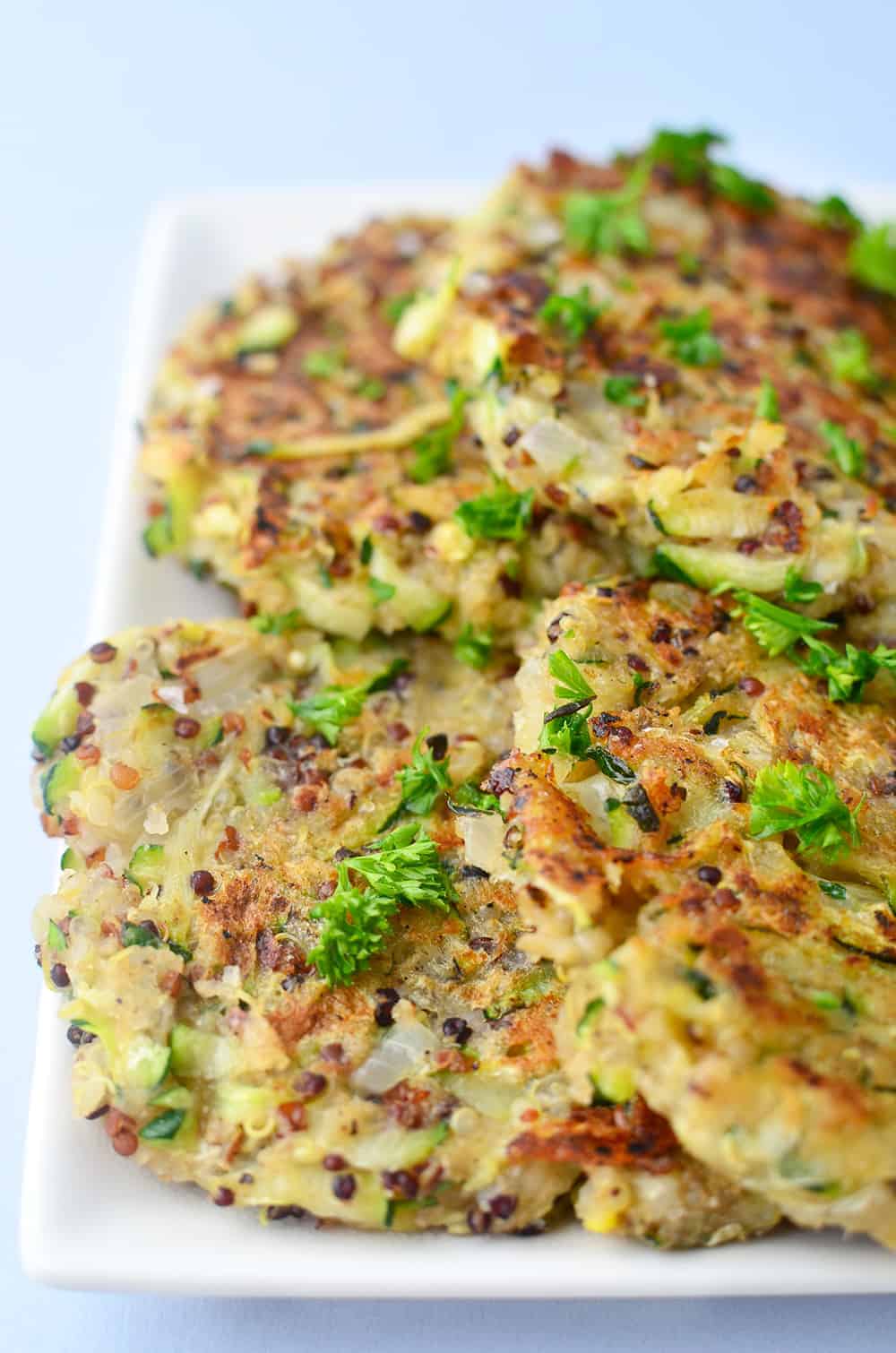 Close Up Shot Of The Zucchini Fritters Garnished With Fresh Herbs 