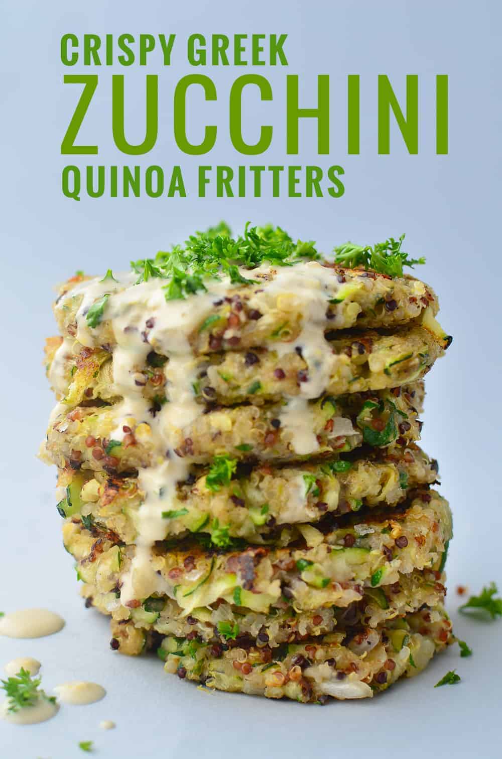 Greek Quinoa Zucchini Fritters! Crispy zucchini fritters with a garlic-hummus sauce. Perfect for leftover zucchini! | www.delishknowledge.com